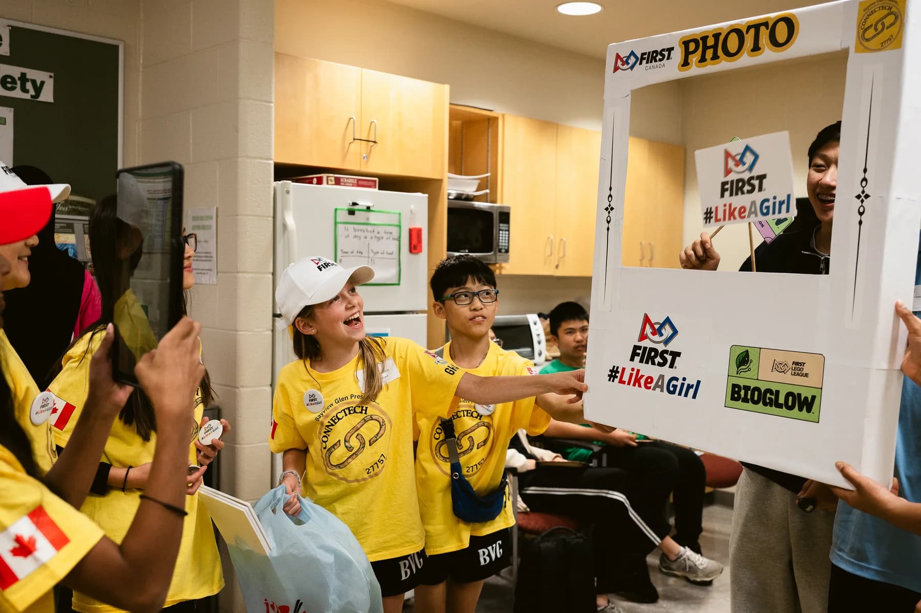 Participants enjoying the FIRSTLikeAGirl photo booth